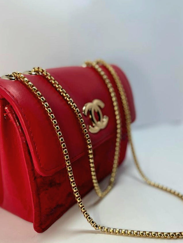 "Red Leather Chanel Crossbody Bag with Gold Chain Strap"