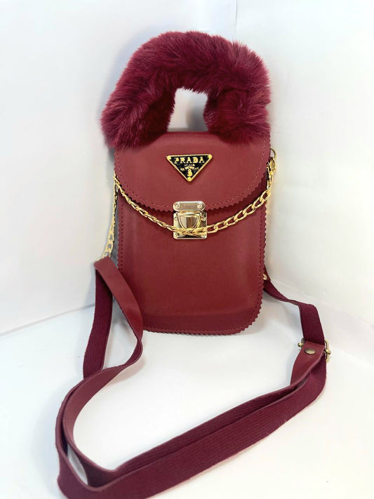 "Luxury Red Prada Handbag with Furry Handle and Gold Chain"