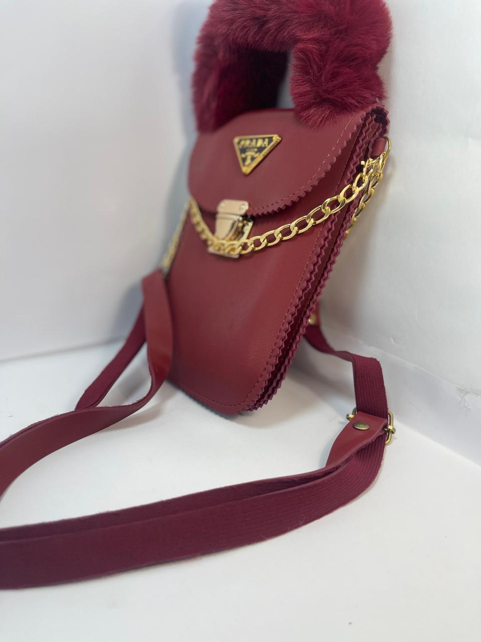 "Luxury Red Prada Handbag with Furry Handle and Gold Chain"
