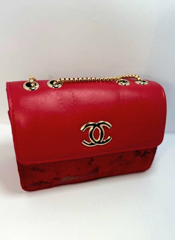 "Red Leather Chanel Crossbody Bag with Gold Chain Strap"