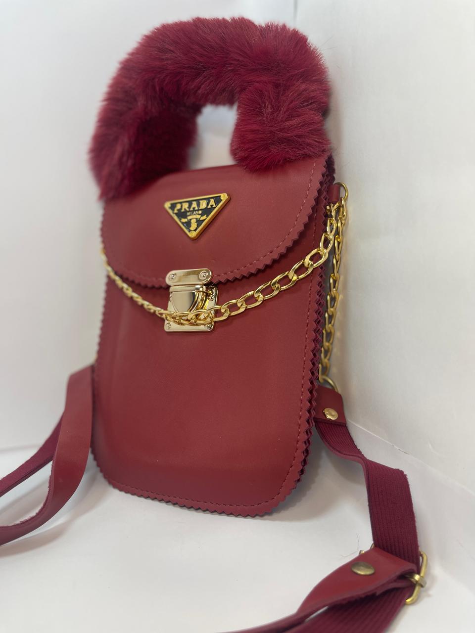 "Luxury Red Prada Handbag with Furry Handle and Gold Chain"