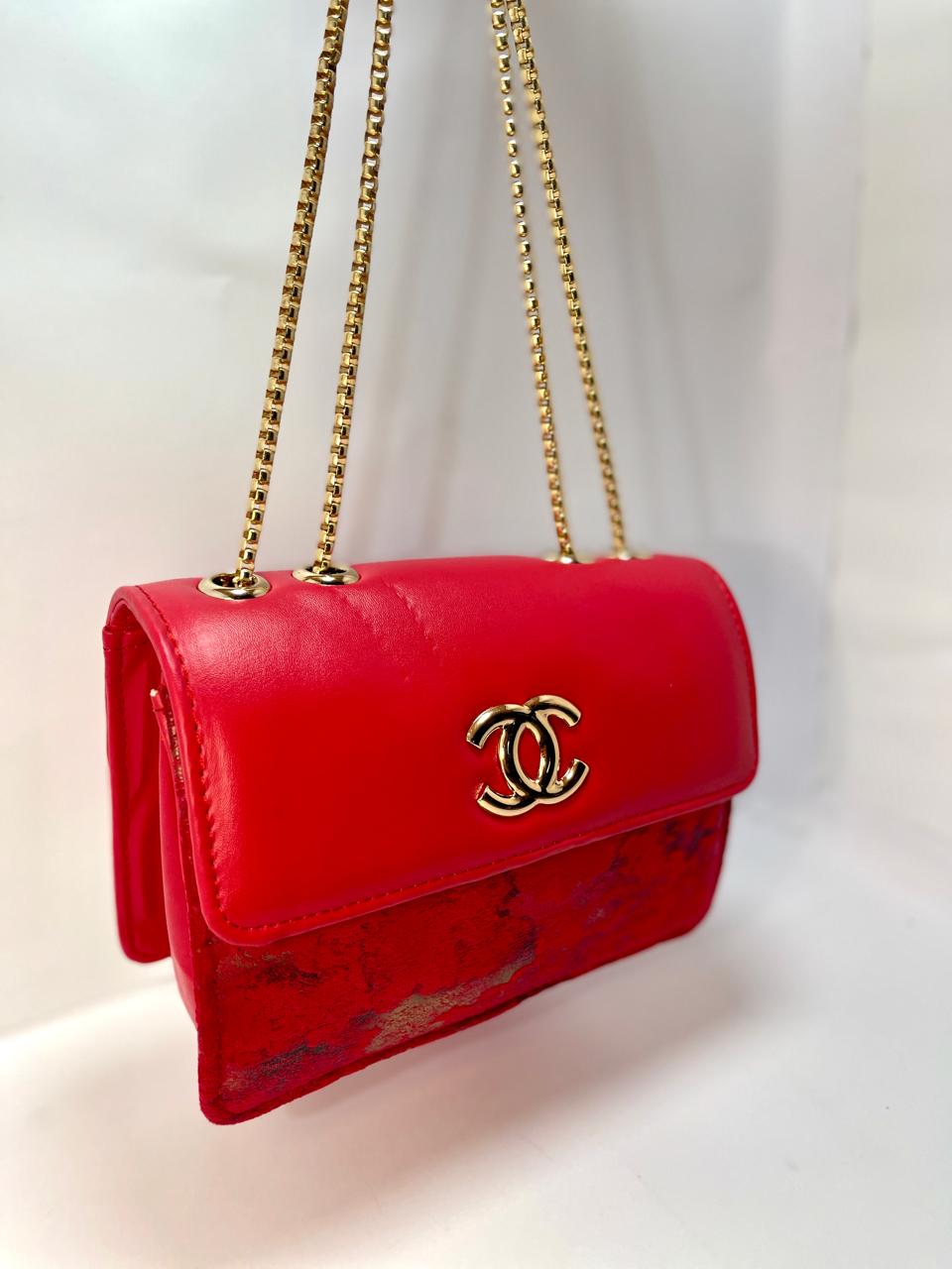 "Red Leather Chanel Crossbody Bag with Gold Chain Strap"