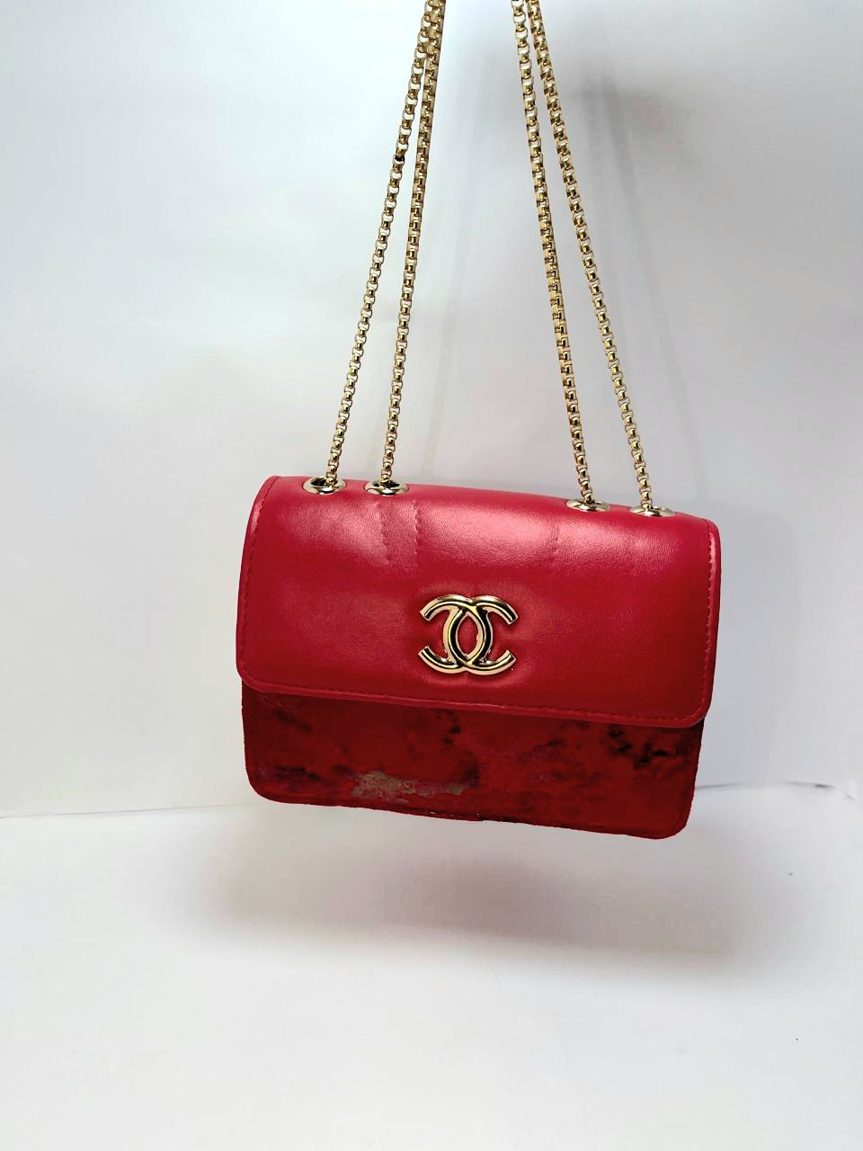 "Red Leather Chanel Crossbody Bag with Gold Chain Strap"